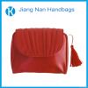 red luxurious makeup bag with tassel