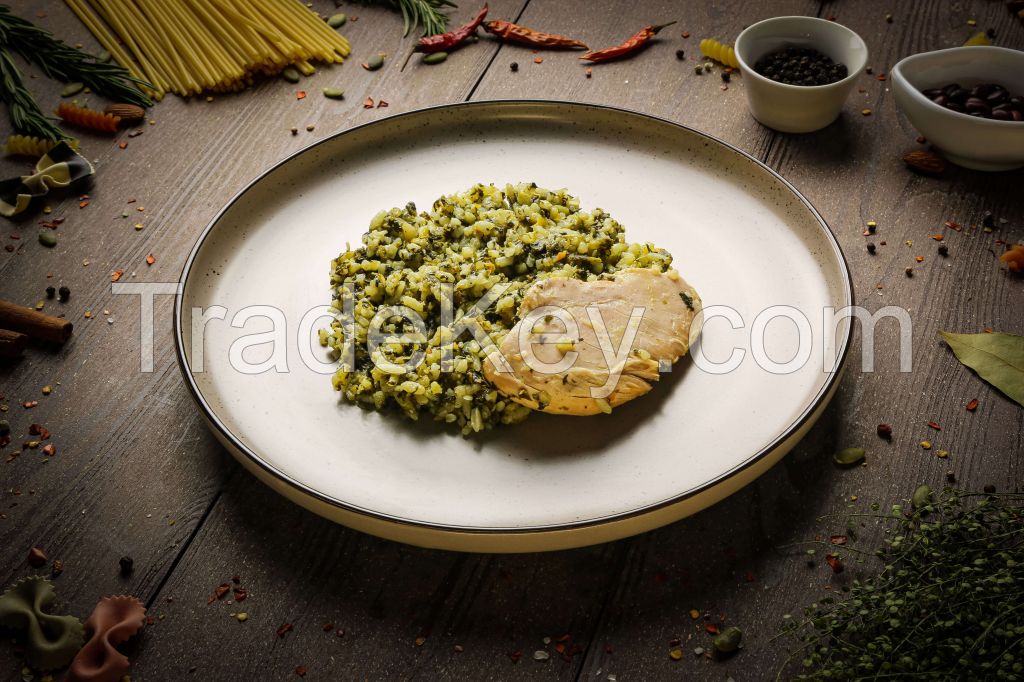 Sous-vide chicken fillet with rice spinach and vegetables