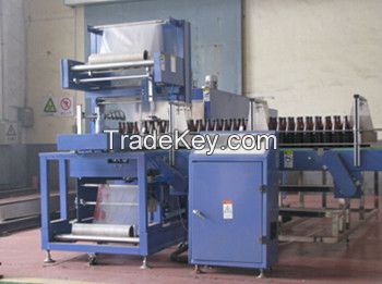 Shrink wrapping machine