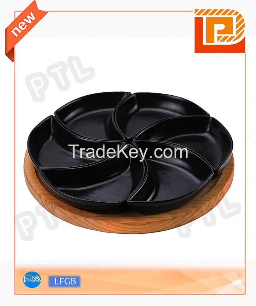 black ceramic food holder in windmill shape