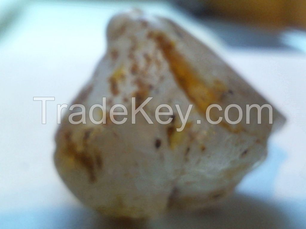 56.00ct. clear rough diamond with triangular flat bottom.