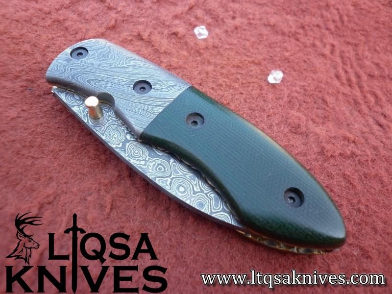 Custom made Damascus steel folding knife