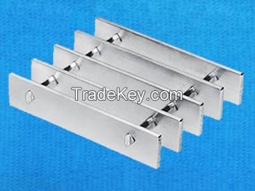 Swage-locked grating