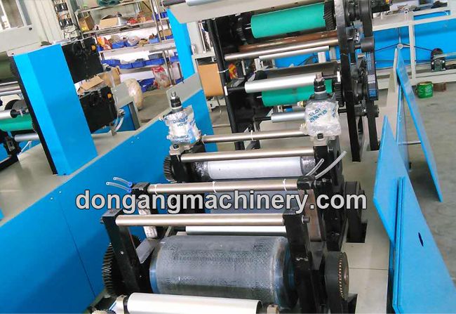 Napkin paper folding machine