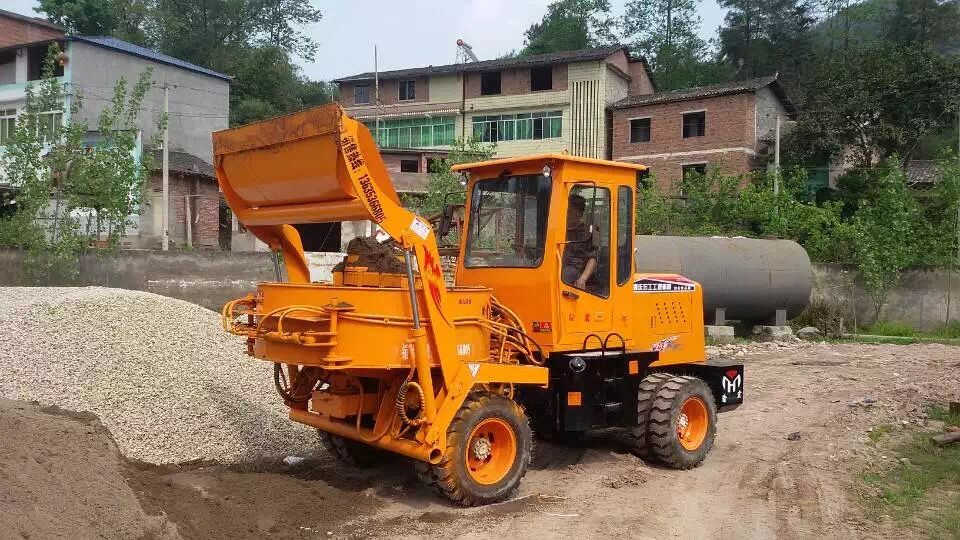 Mobile self-loading concrete mixer