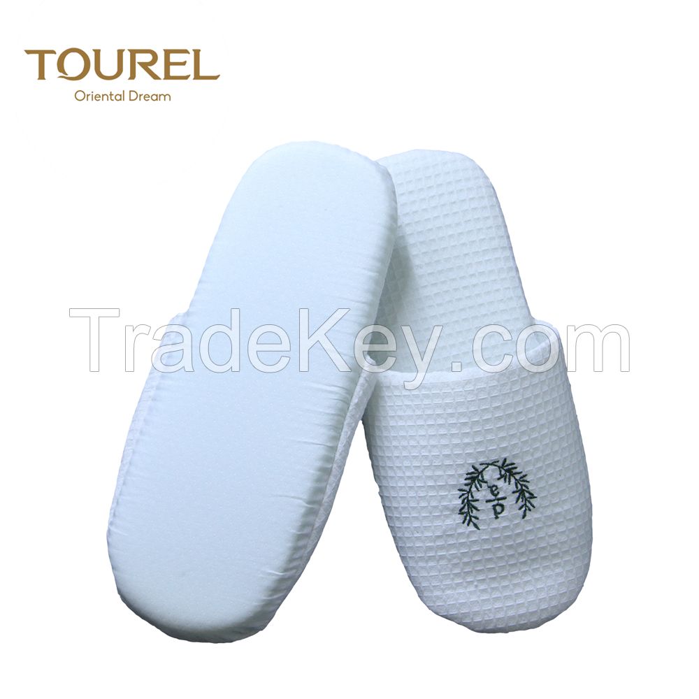 white personalised hotel slipper with closed toe style 