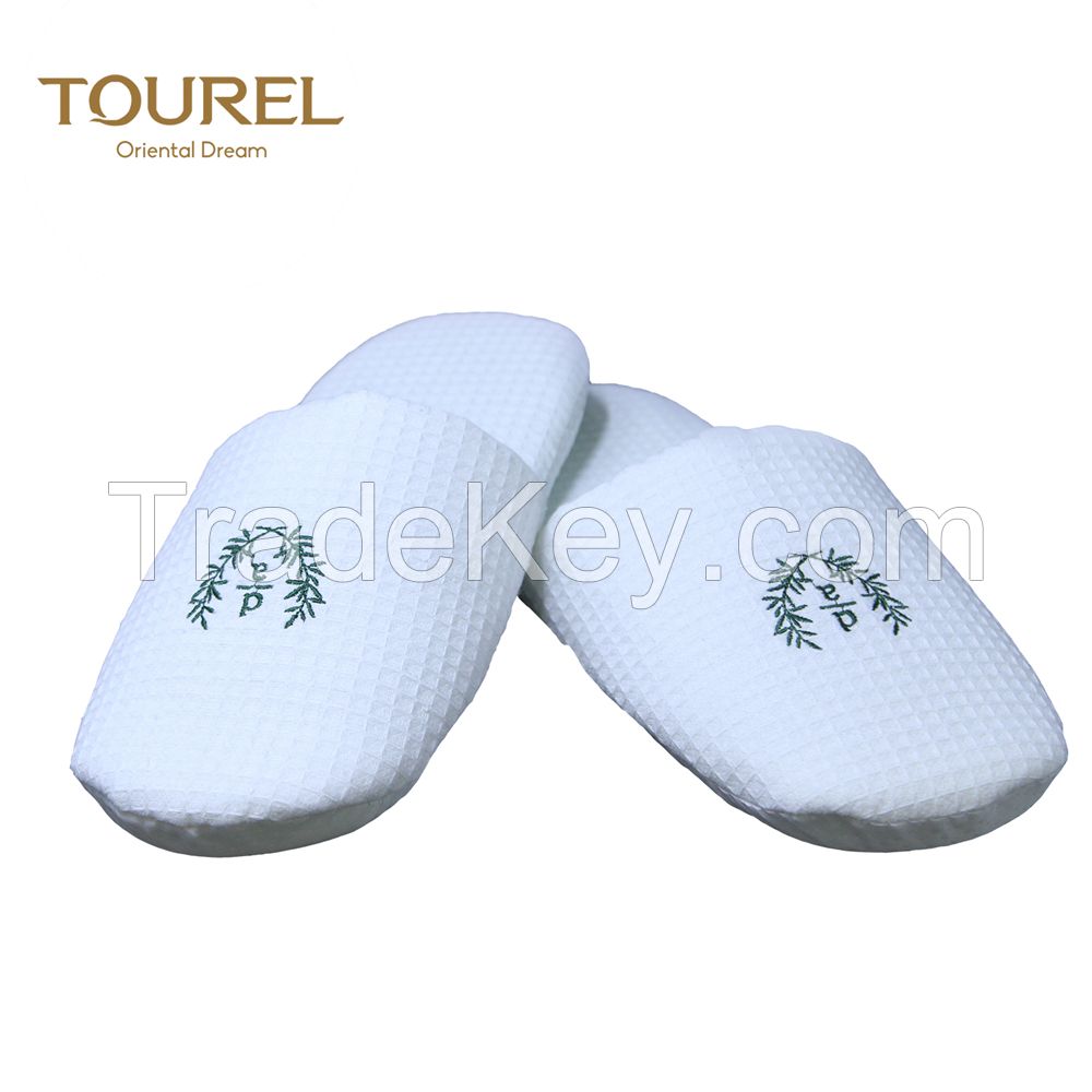 white personalised hotel slipper with closed toe style 