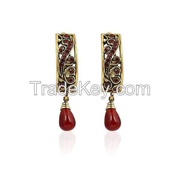 Crescent Shaped Earrings With Maroon Stones Studded On To Well-Crafted Golden Metal