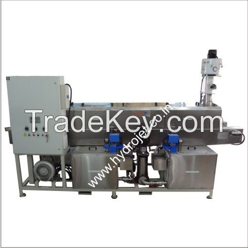 Conveyorized component cleaning machine