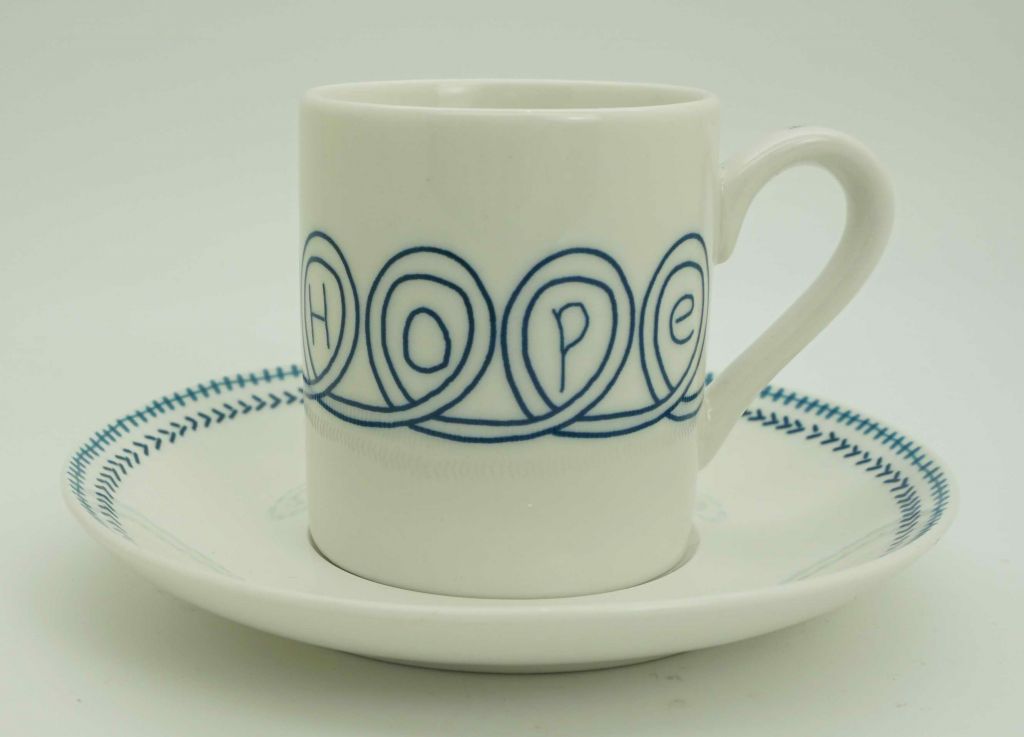 White fine bone china with overglazed color figure