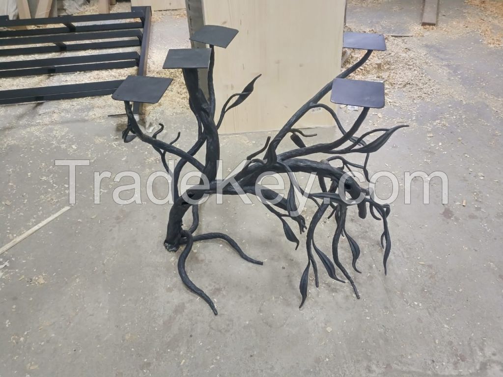 Tables made of wood and resin with forged underframes