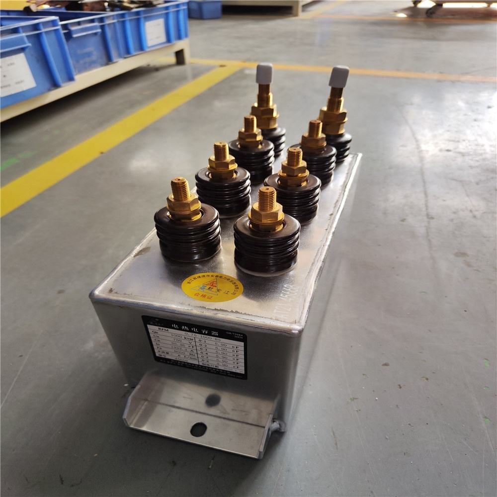 Water cooled capacitors for electric heating installations