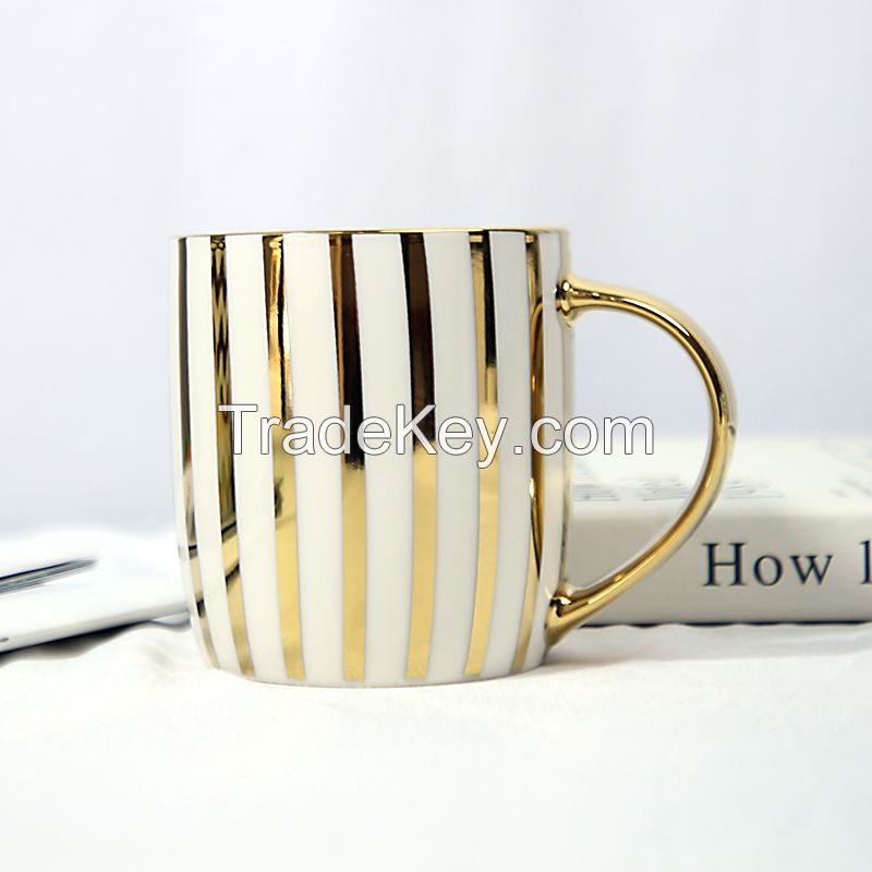 Gold Handle Coffee Mug with Geometric Design