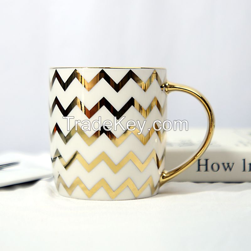 Gold Handle Coffee Mug with Geometric Design