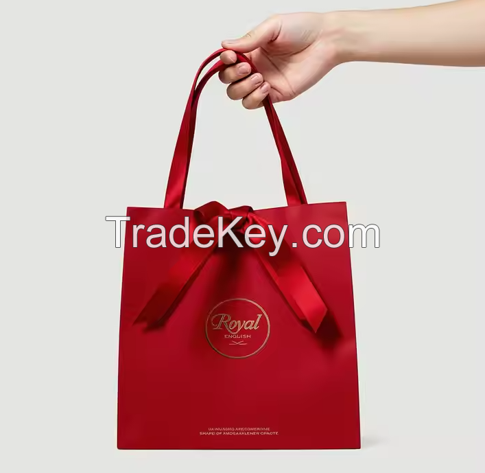 Custom Printed Luxury Red Kraft Paper Bags with Ribbon Wedding Gift and Shopping Packaging Art Paper Style