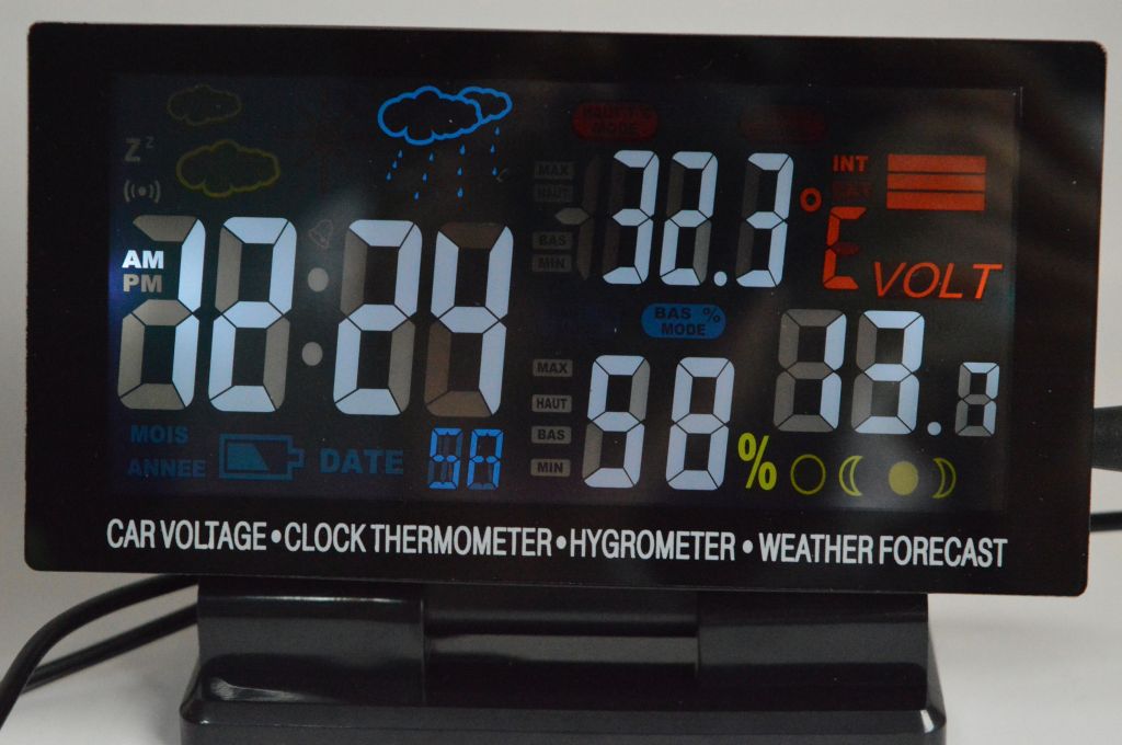 Car voltage meter with in/out thermometer, humidity, weather indication, moon phase