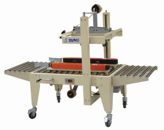 Side belts driven carton sealer