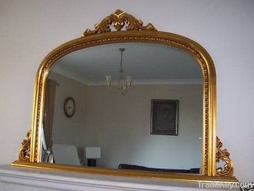 ornate decorative wall mirror , wooden overmantel