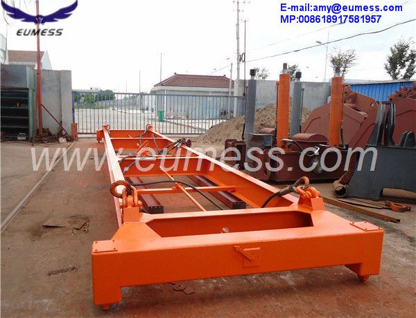 Semi-automatic container spreader