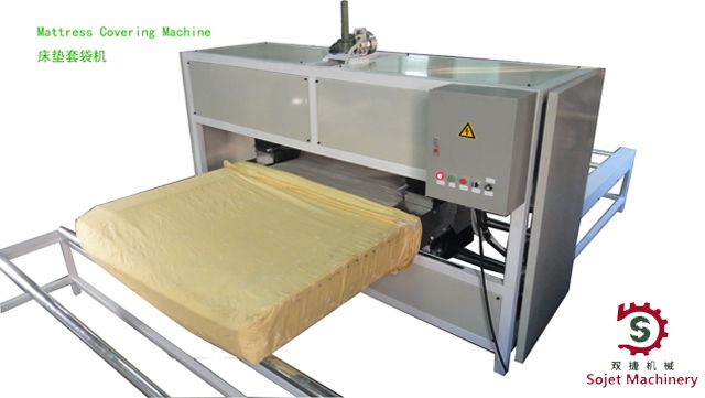 Mattress covering machine