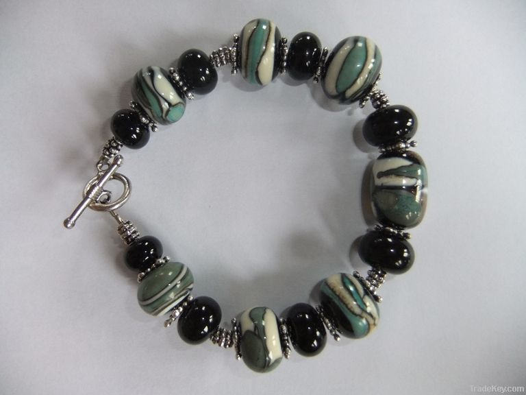 Lampworked bead bracelet in black, ivory, copper green