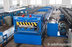 Steel deck floor forming machine