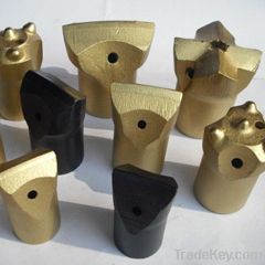 Tapered chisel type bit