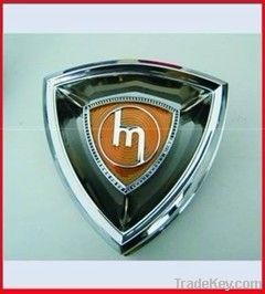 car emblem, car badge, chrome auto emblem