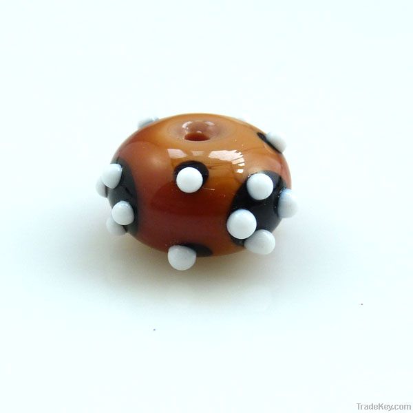 lampwork glass amber bead with white dots