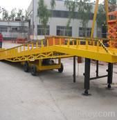 Mobile hydraulic yard ramp/leveler