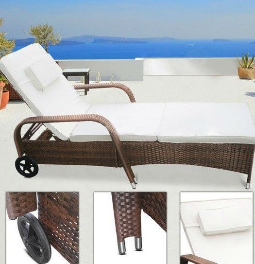 Rattan sun lounger with armrest