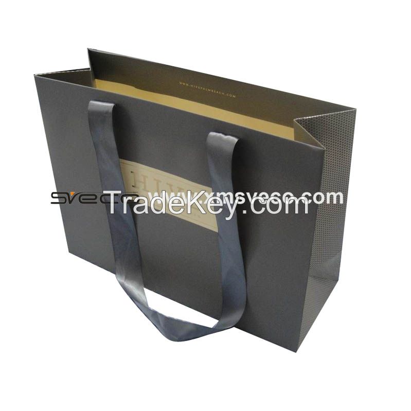 Paper bag with handle, glossy lamination