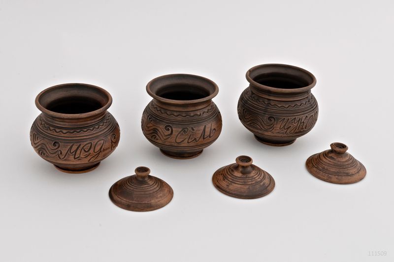 Ceramic pot with lid made of red clay. 