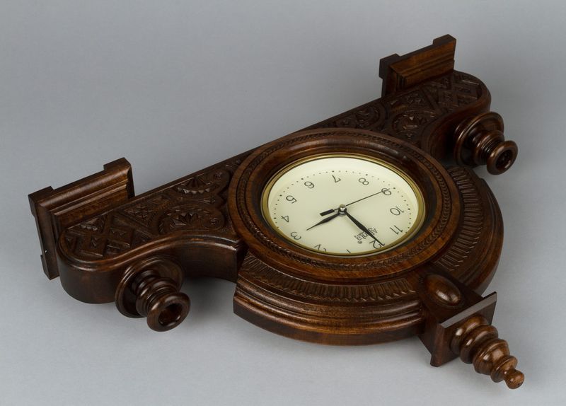 Desk wooden clock with hand carved pattern.