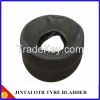 Tire curing bladders
