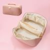 Large Capacity PU Leather Weave Cosmetic Bag Women Portable Travel Makeup Bag With Handle and Divider Flat Lay