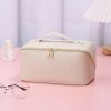 Large Capacity PU Leather Weave Cosmetic Bag Women Portable Travel Makeup Bag With Handle and Divider Flat Lay