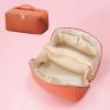 Large Capacity PU Leather Weave Cosmetic Bag Women Portable Travel Makeup Bag With Handle and Divider Flat Lay