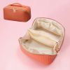 Large Capacity PU Leather Weave Cosmetic Bag Women Portable Travel Makeup Bag With Handle and Divider Flat Lay