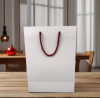 Wholesale Eco-Friendly Luxury Kraft Paper Tote Bags with Ribbon Custom Logo Stand-Up Recyclable Retail Packaging Use