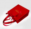 Custom Printed Luxury Red Kraft Paper Bags with Ribbon Wedding Gift and Shopping Packaging Art Paper Style
