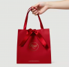 Custom Printed Luxury Red Kraft Paper Bags with Ribbon Wedding Gift and Shopping Packaging Art Paper Style