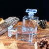 Cylindrical glass perfume bottle
