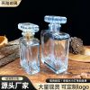 Cylindrical glass perfume bottle