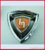 car emblem, car badge, chrome auto emblem