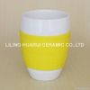 Ceramic coffee mug with silicone lid and sleeve