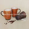 Ceramic coffee mug with silicone lid and sleeve