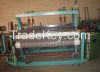 shuttless weaving machine
