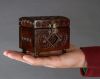 Small wooden brown jewelry box.