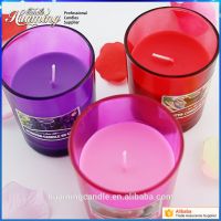 scented candles in colored glass jar 